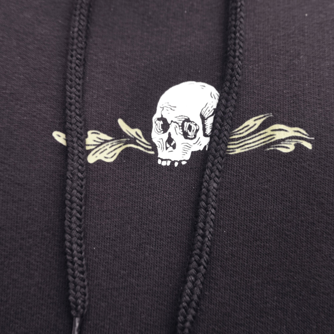 Black hoodie with a skull and crossbones design on the chest.